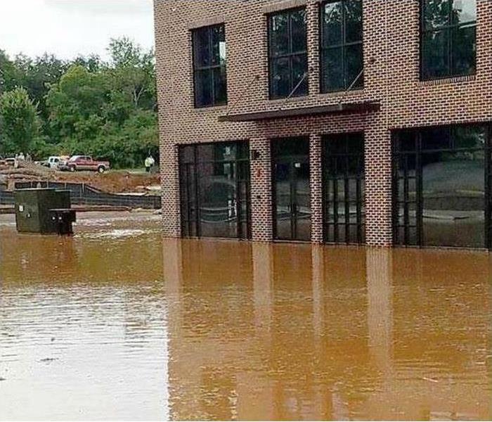 Outside of a commercial building surrounded from flooded waters
