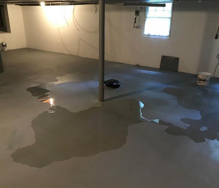 Basement with pools of water.